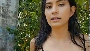 Beautiful black-haired girl gives a great presentation in the woods