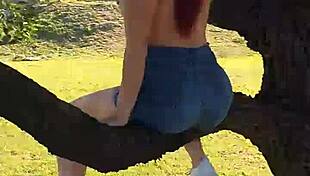 Watch a guy pissing from a tree in the park