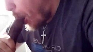 This guy eagerly sucks on a massive black cock in a casual encounter.