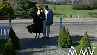 Blonde woman relaxes in the bath with a man