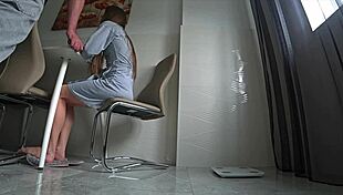 Cheating wife fucks friend in kitchen while husband works.