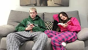 Stepbrother watches porn and jerks off beside stepsister. She opts to give him a handjob instead of reading.