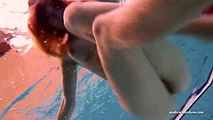 I have firm big tits in a red dress underwater.