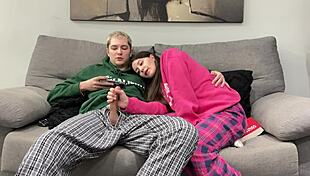 Stepbrother watches porn and jerks off beside stepsister. She opts to give him a handjob instead of reading.