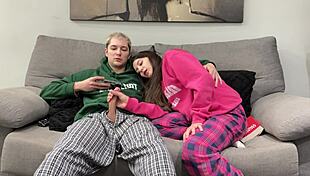 Stepbrother watches porn and jerks off beside stepsister. She opts to give him a handjob instead of reading.