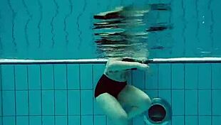 I admire Dashka's beautiful big tits in the pool