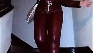 Leather catsuit clings to her legs under the miniskirt
