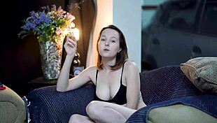 Watch this sexy brunette smoking in black lingerie?