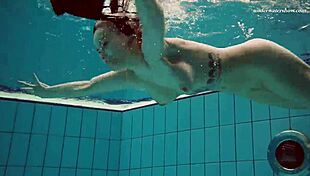 I admire Dashka's beautiful big tits in the pool