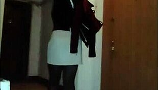 Leather catsuit clings to her legs under the miniskirt