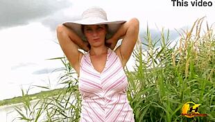 Blonde masturbates outdoors on sunny lake!