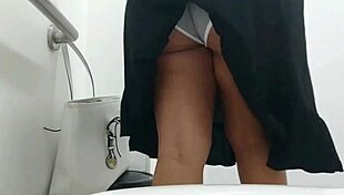 Hidden camera in public bathroom catches curvy girl peeing