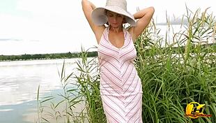 Blonde masturbates outdoors on sunny lake!