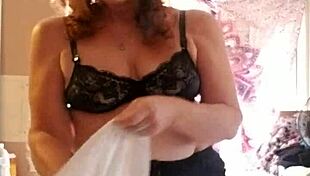 Mature Woman Applies Lotion to Her Sexy Skin in Nude Setting