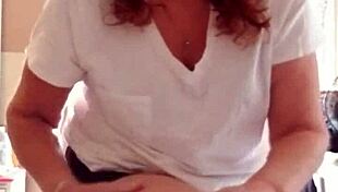 Mature Woman Applies Lotion to Her Sexy Skin in Nude Setting