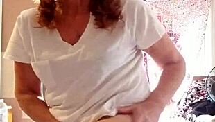 Mature Woman Applies Lotion to Her Sexy Skin in Nude Setting