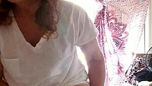 Mature Woman Applies Lotion to Her Sexy Skin in Nude Setting