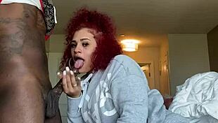 Fat redhead lady sucks big black cock from POV.