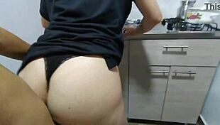 Blonde milf in short dress seduces in kitchen, gets fucked and creampied.