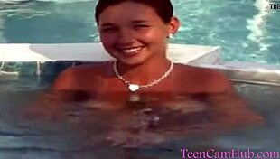 Big tits by the pool in a bikini, teasing the model