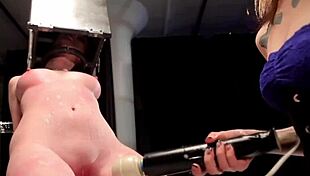 BDSM lezdom domina binds and punishes her submissive lesbian partner