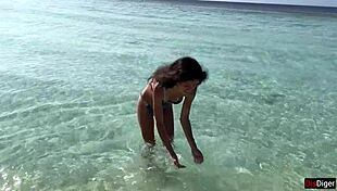 Old man pisses on shocked girl at public beach in golden shower scene