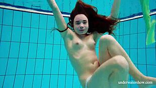 Small Russian girl Nina Mohantka shows her natural tits and hairy beaver