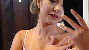 Mia piper strips and masturbates before mirror.