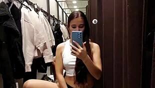 Beautiful tanned girl next door enjoys risky orgasms in public fitting room while naked