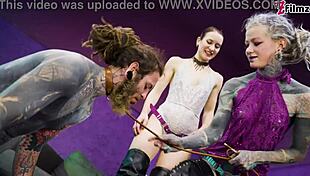 Heavy tattooed sub gets pegged by two dominas