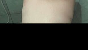 Feeling intense pleasure as I give a delicious blowjob in the steamy bath, my big ass on display.