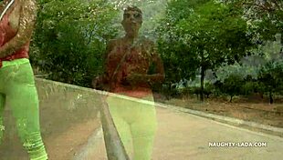 Camel-toe flashing in public with milf showing off tits and leggings in outdoor nude scene.