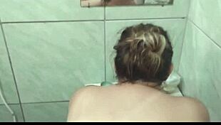 Feeling intense pleasure as I give a delicious blowjob in the steamy bath, my big ass on display.