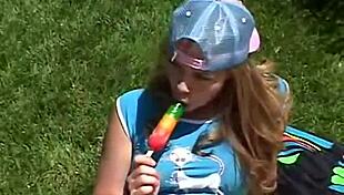 Little 18+ April, A Petite Brunette Teen, Rubs Her Clit Outdoors While Sucking On A Popsicle