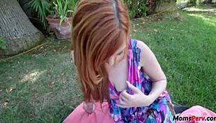 Outdoor fuck with redhead stepmom Lauren Phillips in taboo scene.