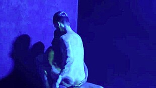 Gay threesome in club smoking area.