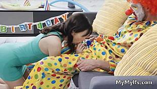 Horny Housewife Engages In Intimate Encounter With Clown In Reality Setting.