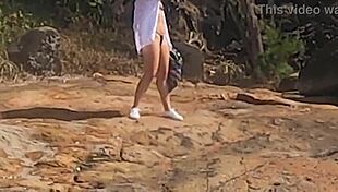 Beautiful young girl gets watched having public sex on beach rocks!