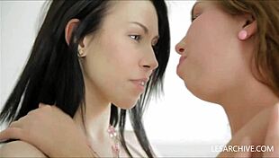 Lesbian girls rub with dildo.