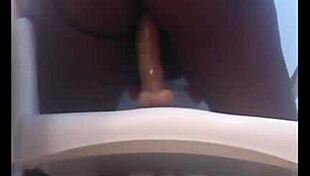 Solo african girl rides dildo on chair