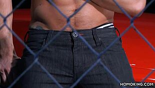 Strong gay couple fucks on red car roof