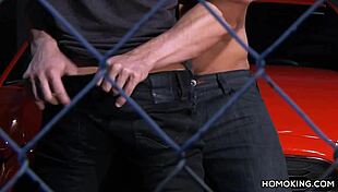 Strong gay couple fucks on red car roof