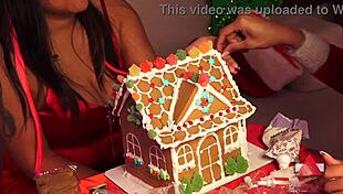 Friends build gingerbread house during christmas holiday