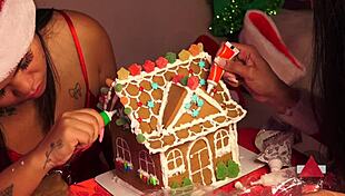 Friends build gingerbread house during christmas holiday