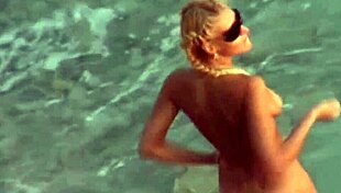 Beach voyeur watches blonde couple on public sand