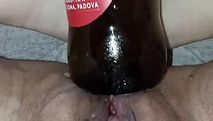 Gretala says, I'm pregnant and rubbing this bottle excitedly.