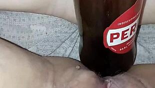 Gretala says, I'm pregnant and rubbing this bottle excitedly.