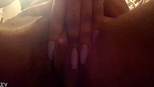 Pretty ebony solo girl reveals her big clit in close up while fingering and masturbating her black pussy.