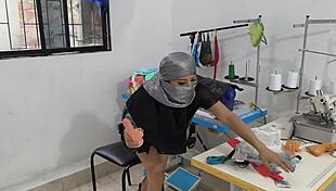 Indian seamstress fingers herself hot in clothing workshop.