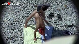 Beach voyeur, curvy milf gives head and gets it from behind in public - you watching?